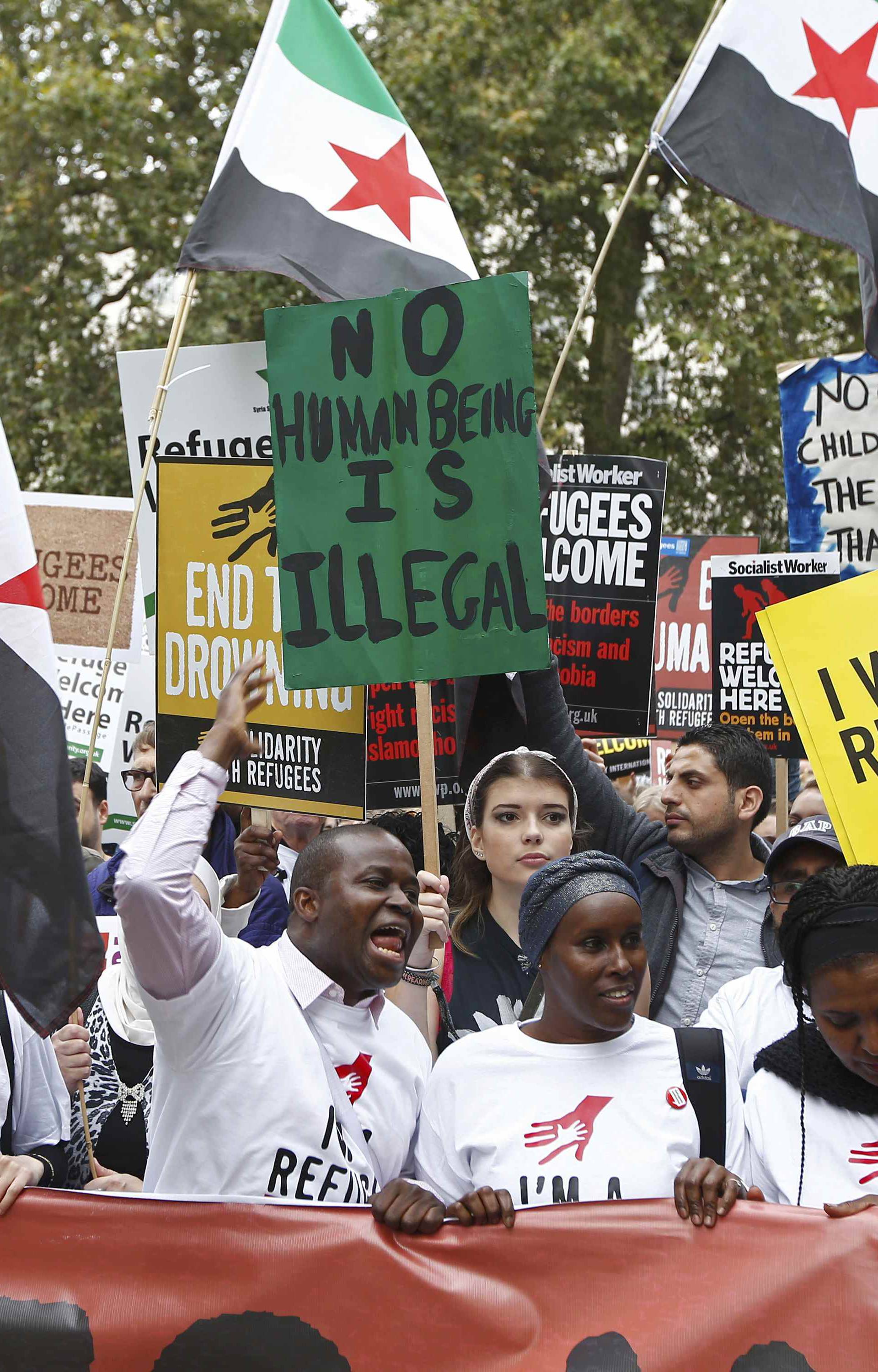 Demonstrators including refugees march to the Houses of Parliament during a protest in support of refugees, in London