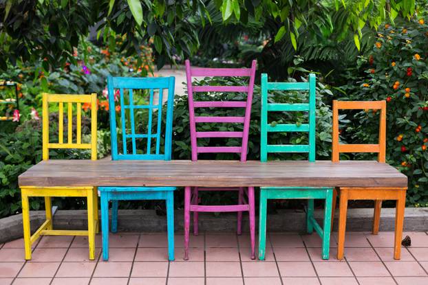 Bench,Made,Of,Five,Wood,Chairs,In,Different,Sizes,And
