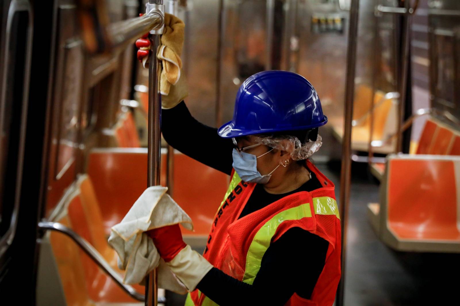 A New York City MTA transit worker cleans a subway car, during the outbreak of the coronavirus disease (COVID-19) in New York