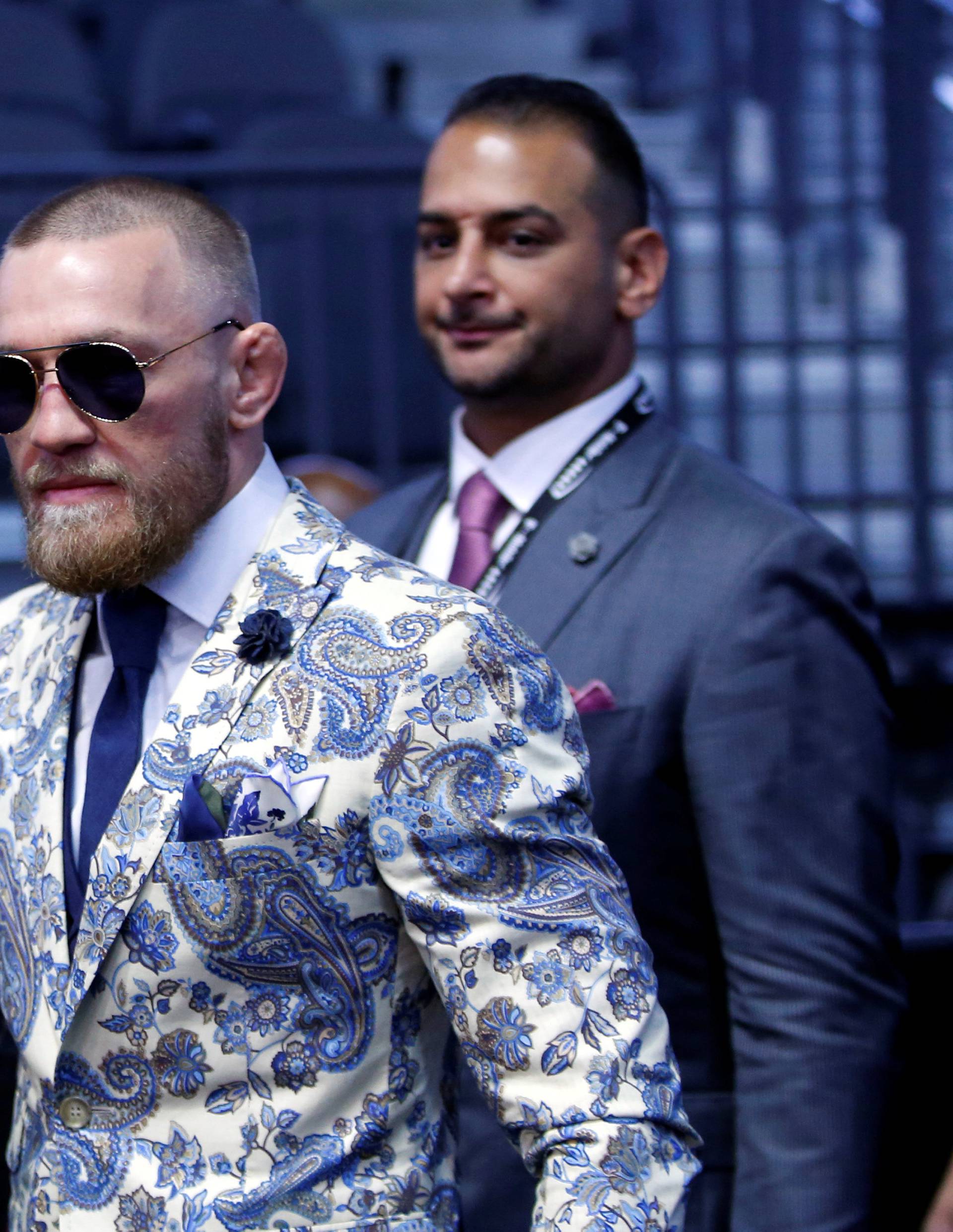 UFC lightweight champion Conor McGregor of Ireland arrives for a post-fight news conference at T-Mobile Arena in Las Vegas