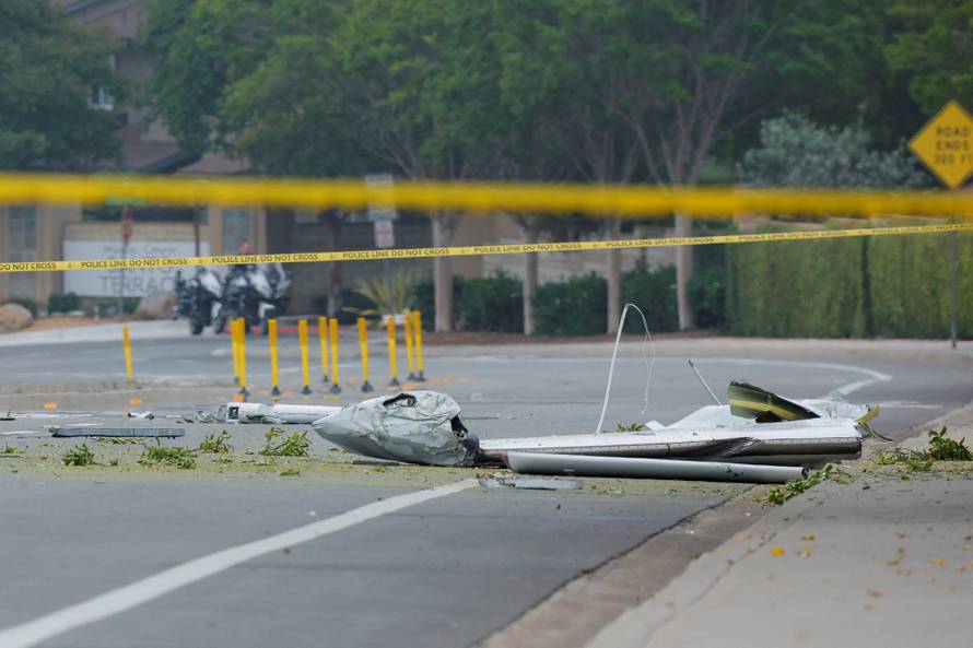 Crash scene after a civilian aircraft went down in a military neighborhood, in San Diego