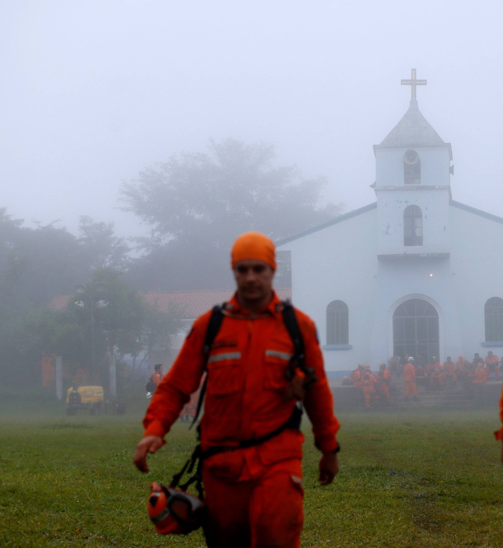 Rescue workers are seen after a tailings dam owned by Brazilian miner Vale SA burst, in Brumadinho