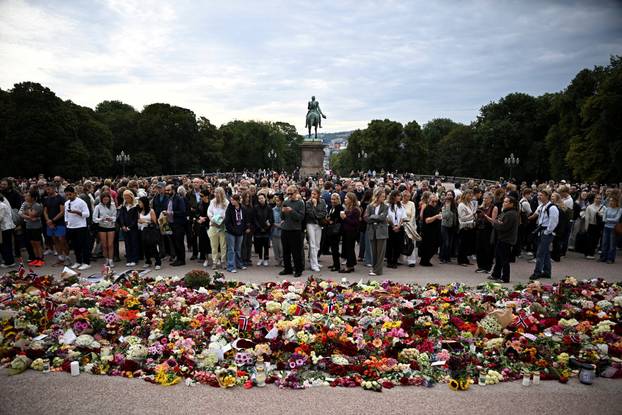 People gather outside the Royal Palace, following the death of Norway's King Harald, in Oslo