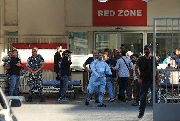 People gather outside a hospital, as more than 1,000 people, including Hezbollah fighters and medics, were wounded on Tuesday when the pagers they use to communicate exploded across Lebanon, according to a security source, in Beirut