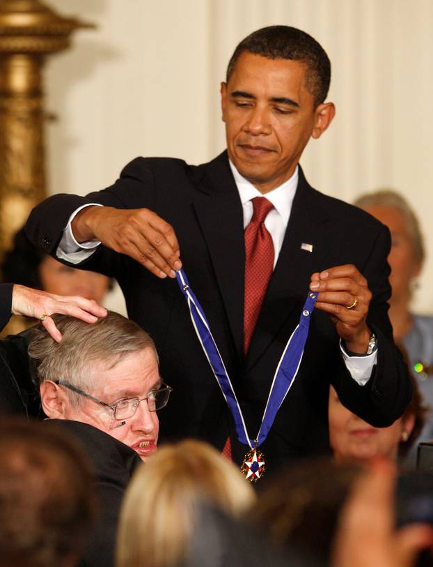 FILE PHOTO: U.S. President Obama presents the medal of freedom to Stephen Hawking in Washington