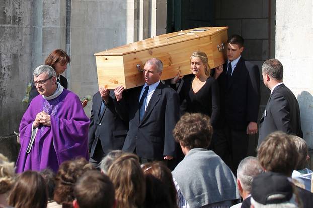 FILE PHOTO: One of the five coffins bearing a member of the Dupont de Ligonnes family leaves the Saint Felix church after the funeral ceremony in Nantes