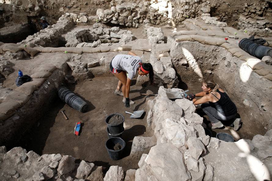 Workers dig at the Tel Megiddo Archaeological site
