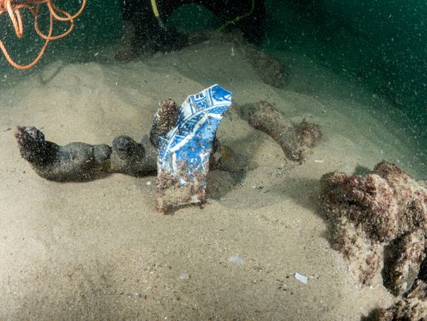 Divers are seen during the discovery of a centuries-old shipwreck, in Cascais