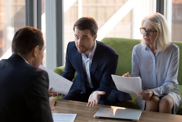 Concerned,Businesspeople,Argue,With,Colleague,Or,Client,Dissatisfied,With,Contract