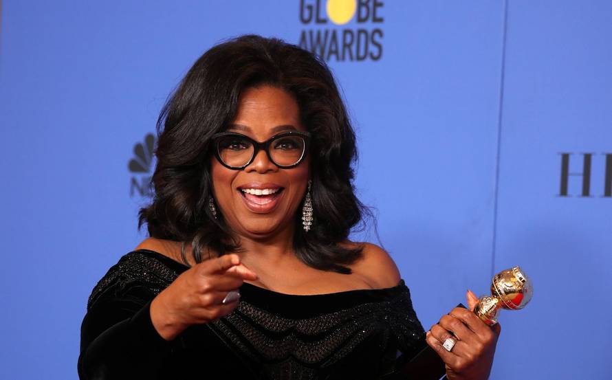 FILE PHOTO: Oprah Winfrey with her Cecil B. DeMille Award at the 75th Golden Globe Awards in Beverly Hills