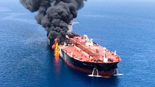 An oil tanker is seen after it was attacked at the Gulf of Oman