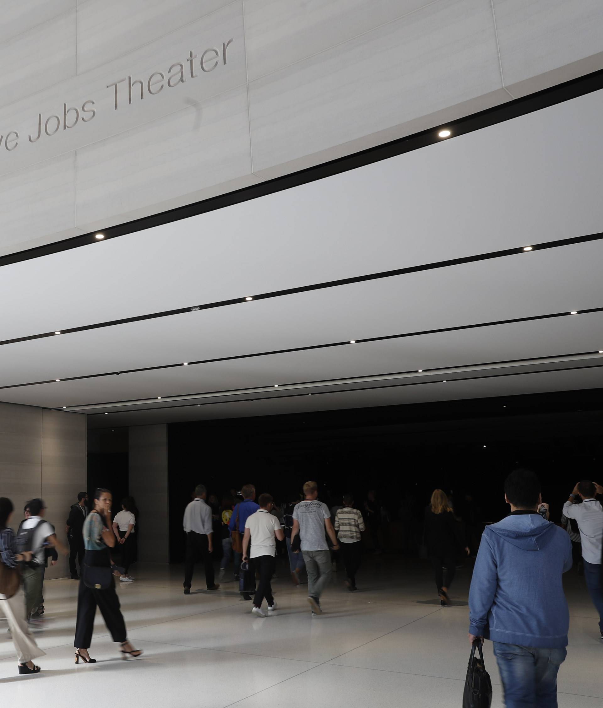 People await the start of a product launch event at Apple's new campus in Cupertino