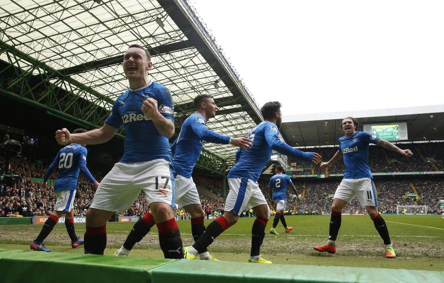Rangers' Lee Hodson celebrates their first goal scored by Clint Hill with teammates