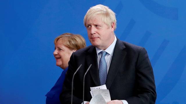FILE PHOTO: German Chancellor Merkel meets Britain's Prime Minister Johnson at the Chancellery in Berlin