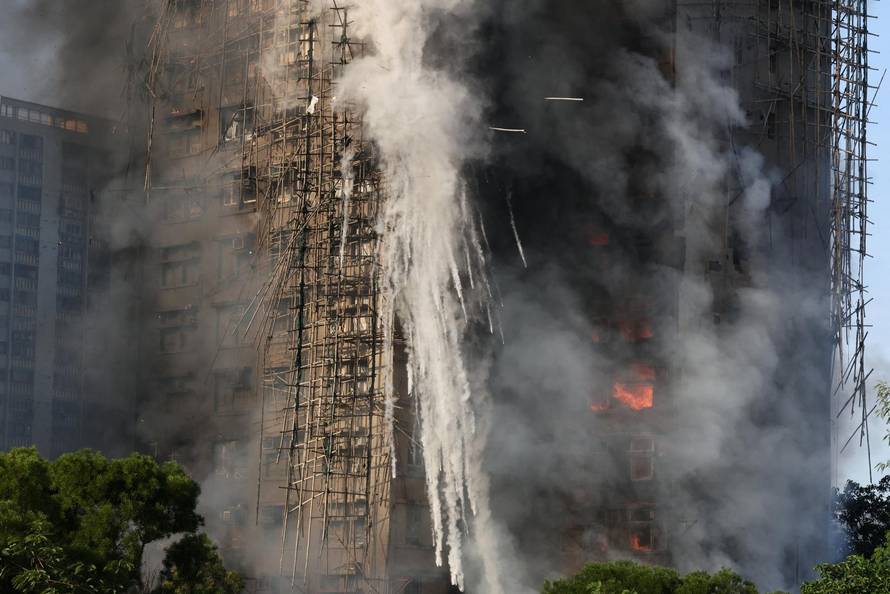 Flames engulf bamboo scaffolding across multiple buildings at Wang Fuk Court housing estate, in Tai Po