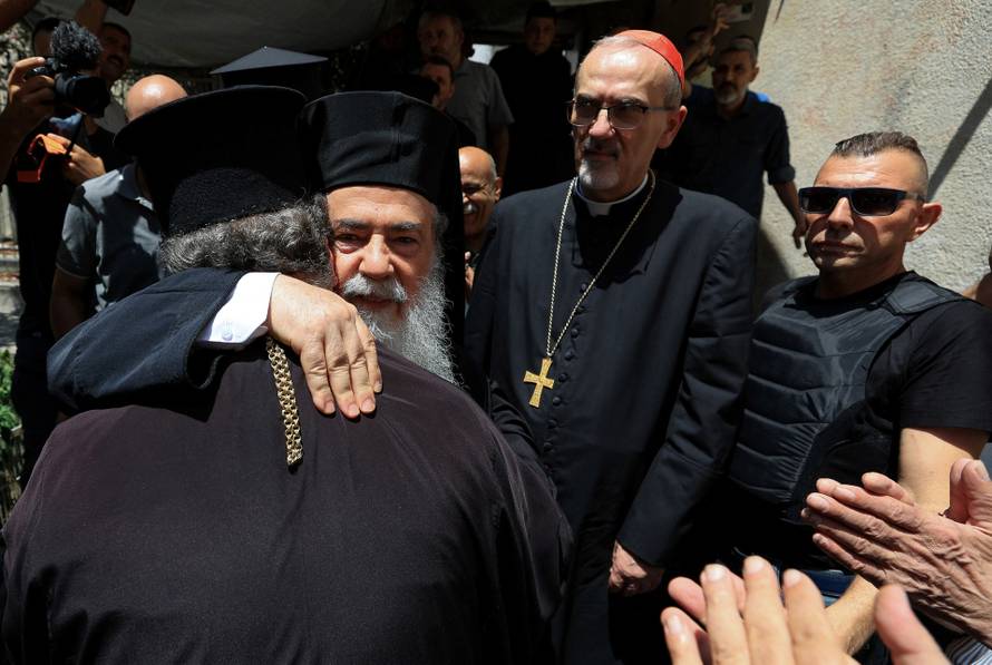 Members of the clergy visit the Greek Orthodox Saint Porphyrius Church, in Gaza City