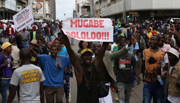 Protesters calling for Zimbabwean President Robert Mugabe to step down take to the streets in Harare