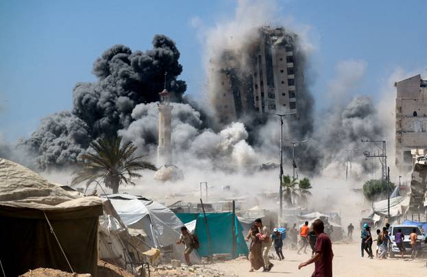 Israeli strike hits the 15-story Mushtaha Tower in Gaza City