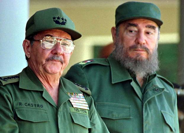 FILE PHOTO: Fidel Castro and his brother Raul Castro preside over a ceremony in Havana, Cuba