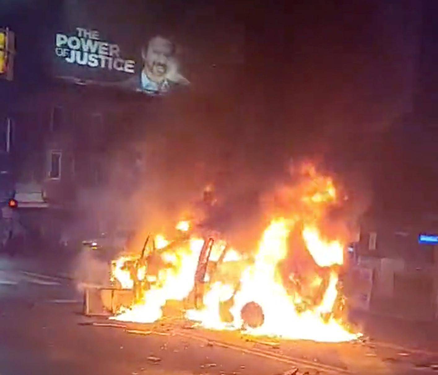 Police vehicle burns during protests after police shooting death of Wallace Jr. in Philadelphia, Pennsylvania