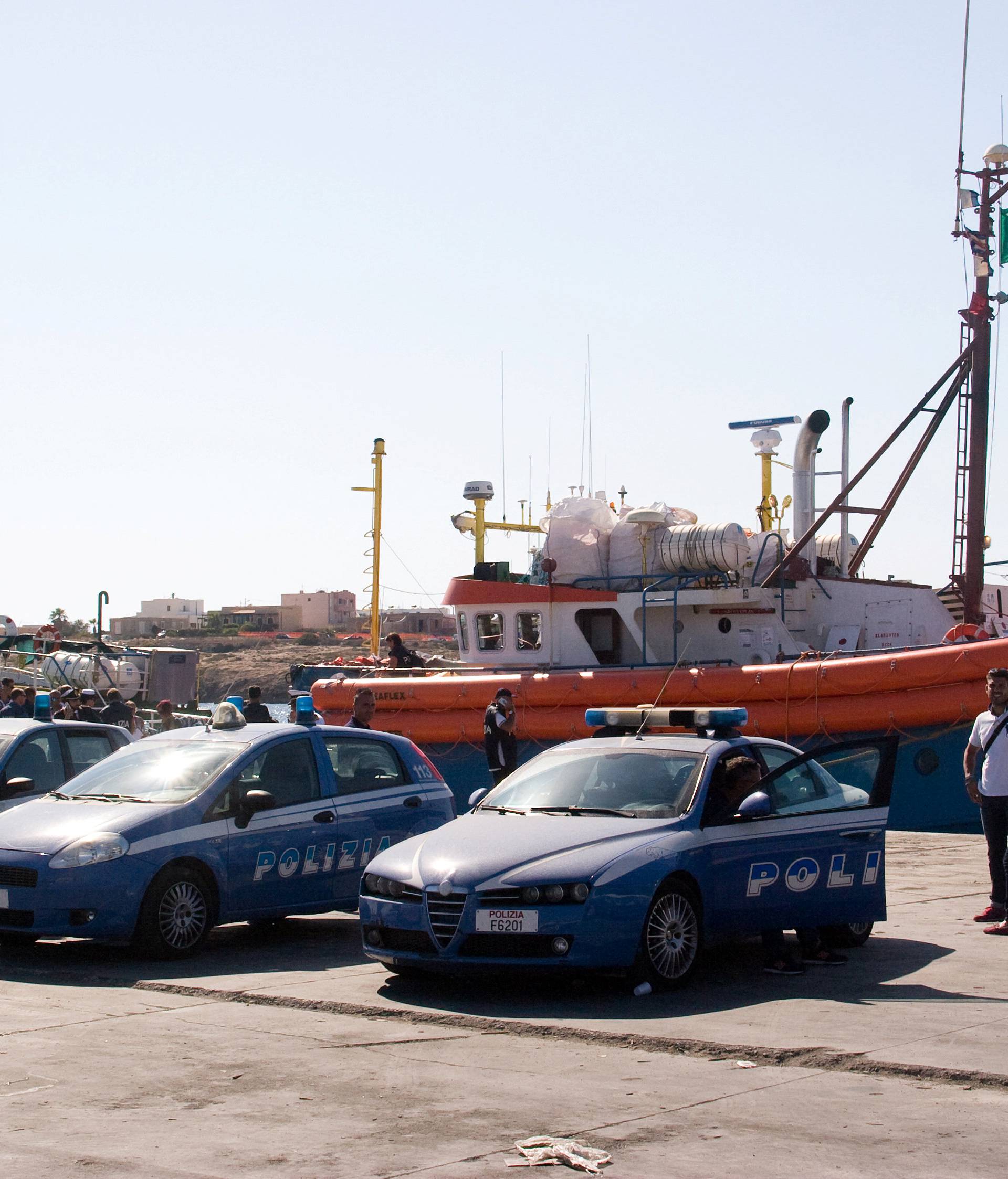 Italian police stand around the German NGO Jugend Rettet ship "Juventa" in Lampedusa harbour, Italy