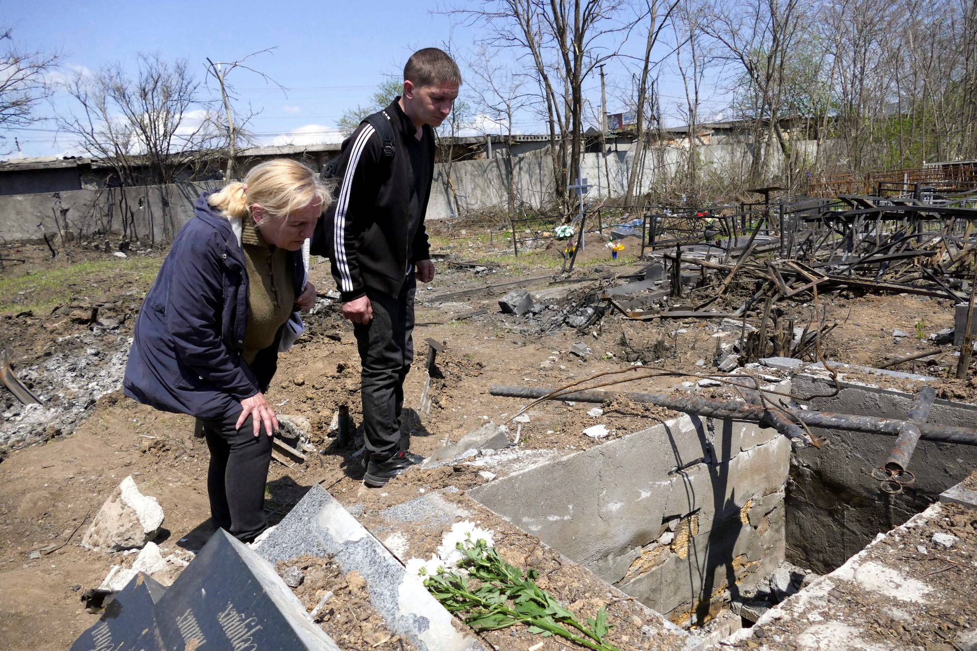 People visit Tairovske cemetery during memorial weekend