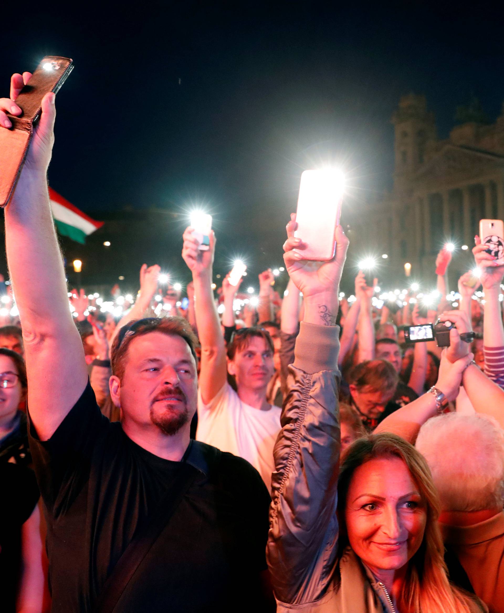 People attend a protest against the government of Prime Minister Viktor Orban in Budapest