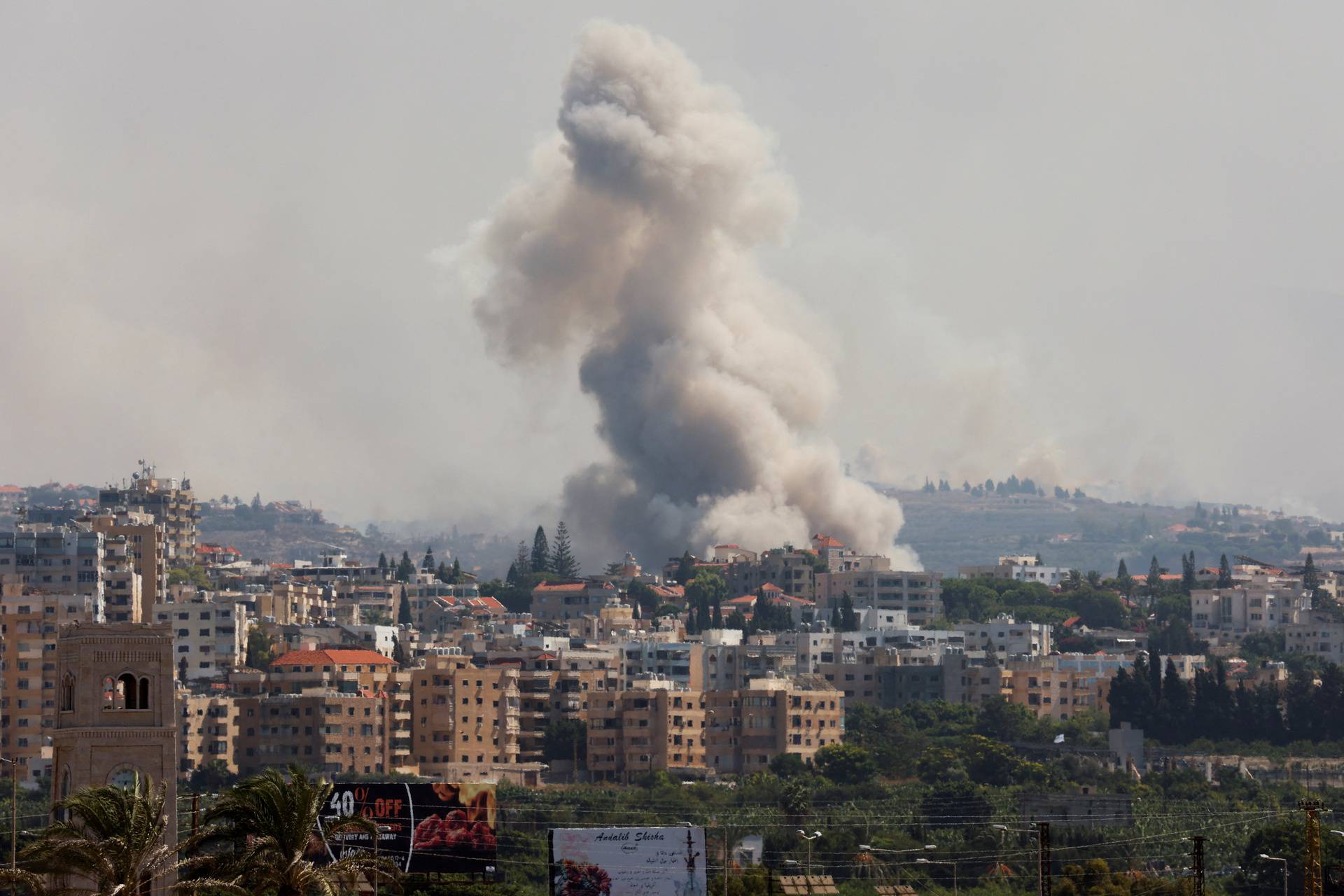 Smoke billows over southern Lebanon following Israeli strikes, as seen from Tyre, southern Lebanon