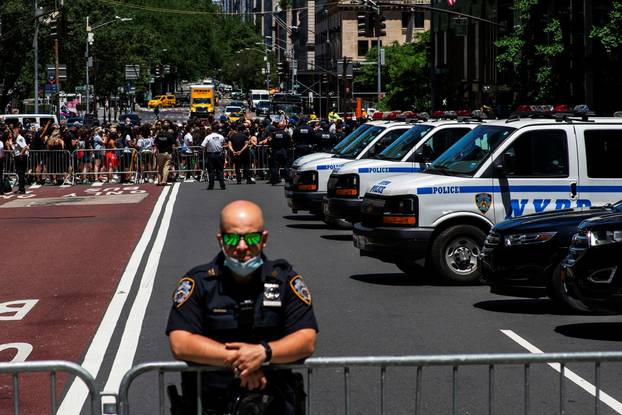 Demonstrators rally as Secret Services agents and NYPD officers stand guard outside Trump Tower during a protest against racial inequality in the aftermath of the death in Minneapolis police custody of George Floyd, in New York City