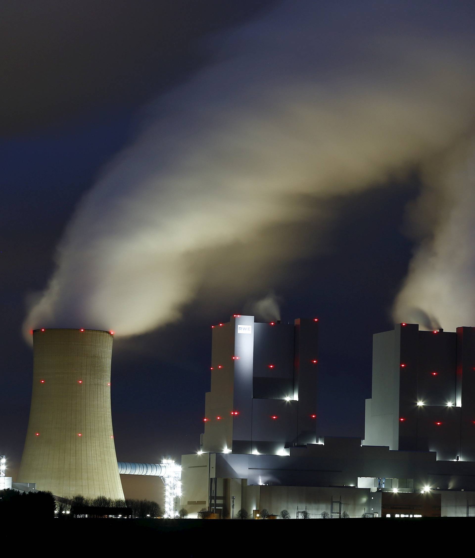 Steam rises from the chimneys of the coal power plant of RWE in Neurath