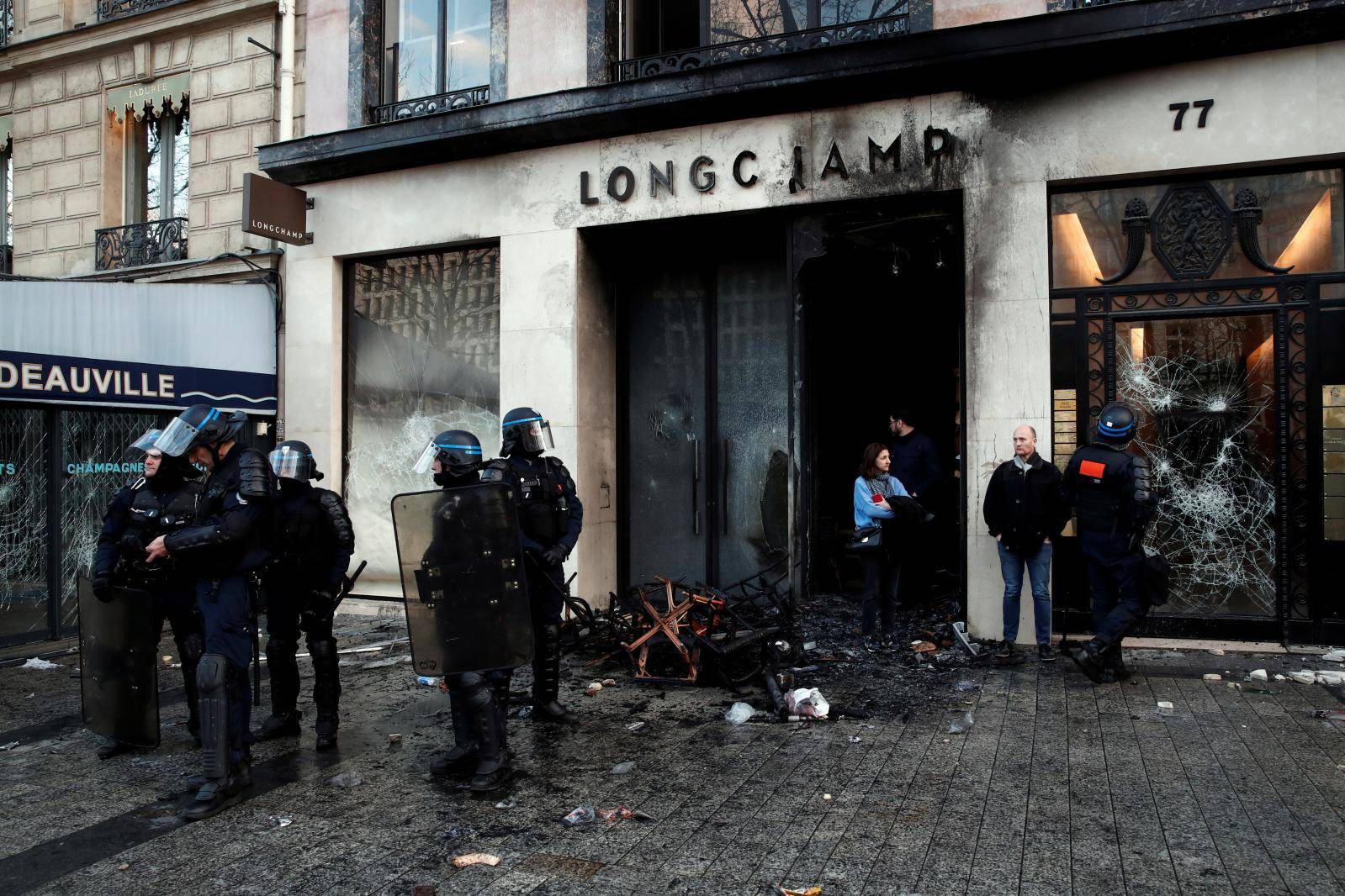 The damaged window of a Longchamp shop is pictured on the Champs-Elysees after a demonstration by the "yellow vests" movement in Paris