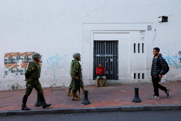 Security forces patrol after a violence outbreak, in Quito