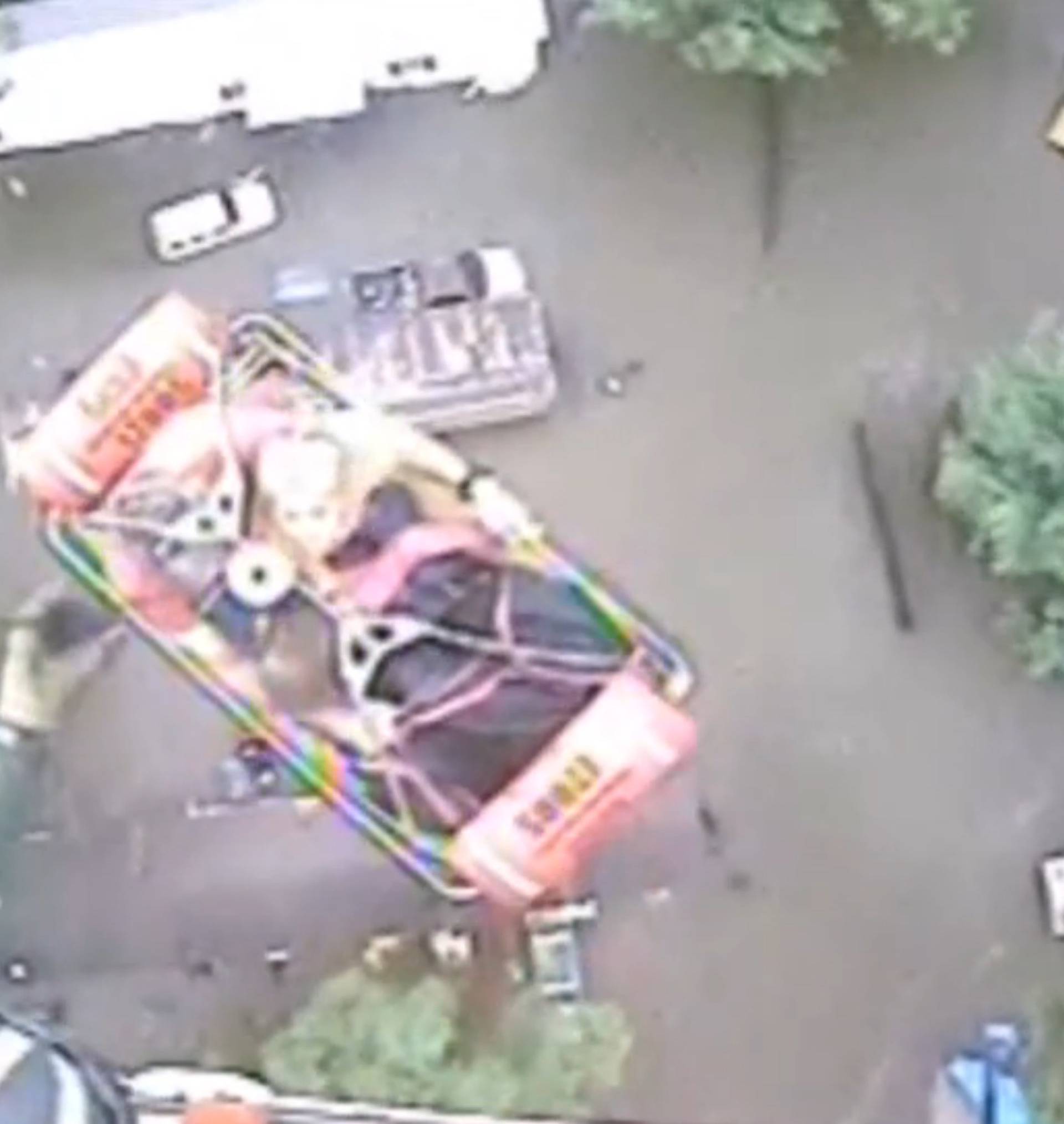 An aircrew from Coast Guard Air Station New Orleans rescues three people from a rooftop due to flooding in Baton Rouge