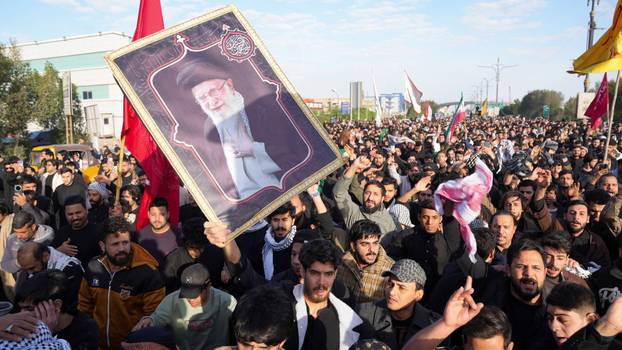 People march after Iran’s Supreme Leader Ayatollah Ali Khamenei was killed in Israeli and U.S. strikes, in Basra