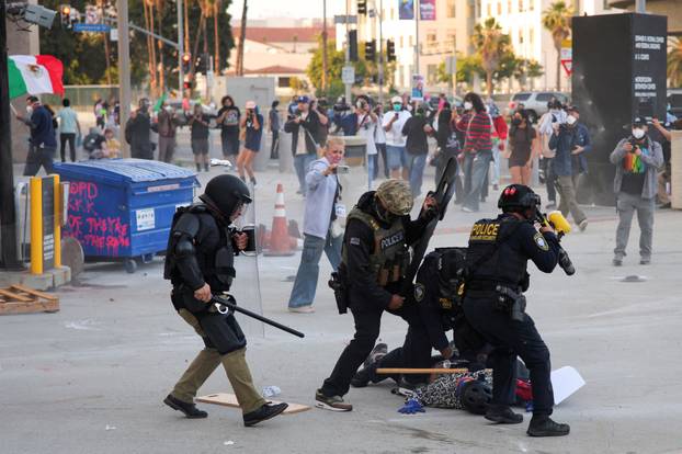 Protesters gather around the Los Angeles Federal Building after multiple detentions by ICE, in Los Angeles