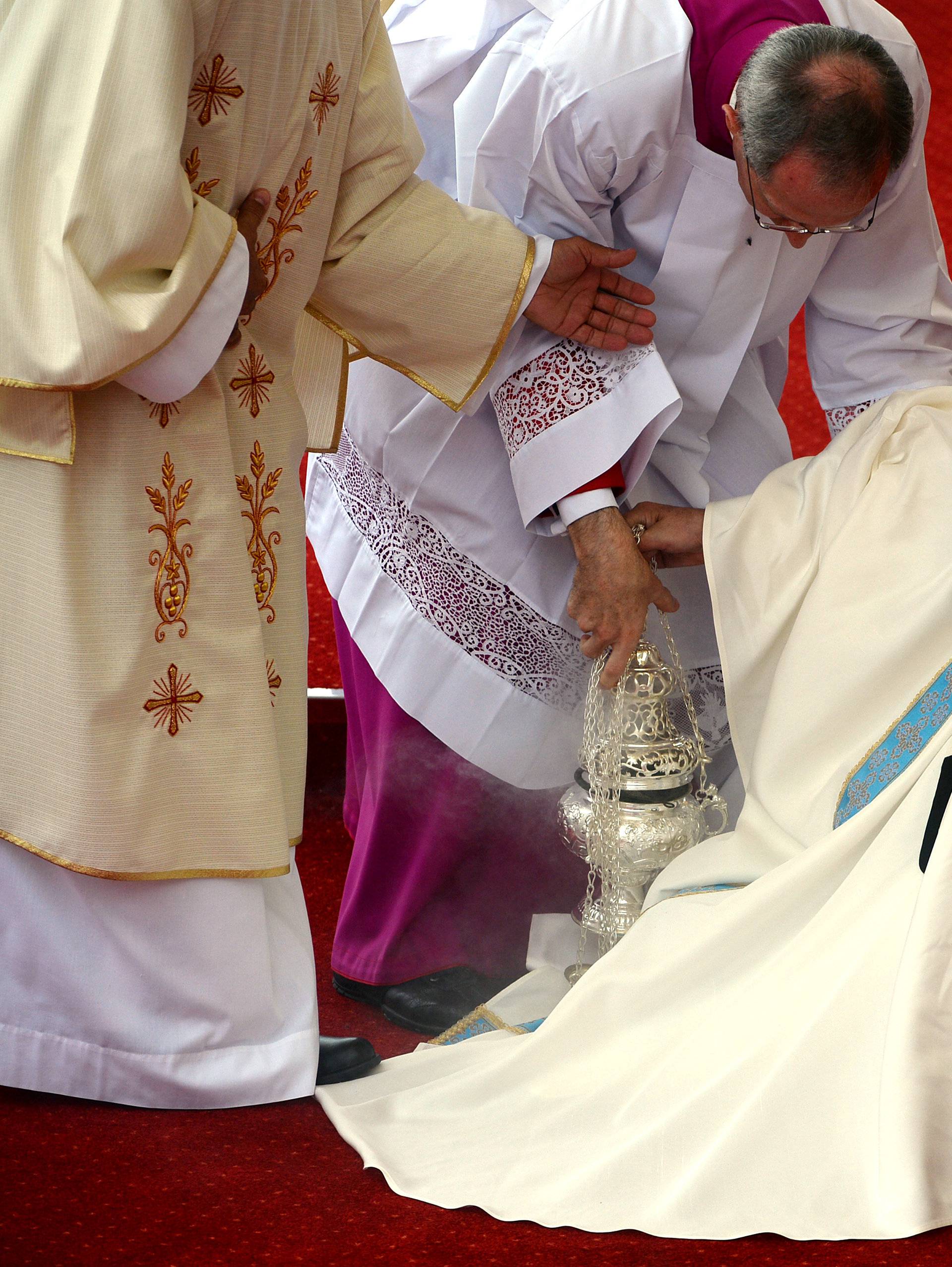 Pope Francis is helped after falling as he arrives at the Jasna Gora shrine in Czestochowa