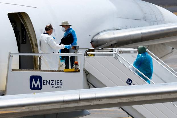 Passengers of the cruise ship MV Hondius, which was affected by a hantavirus outbreak, arrive at Tenerife Sud airport