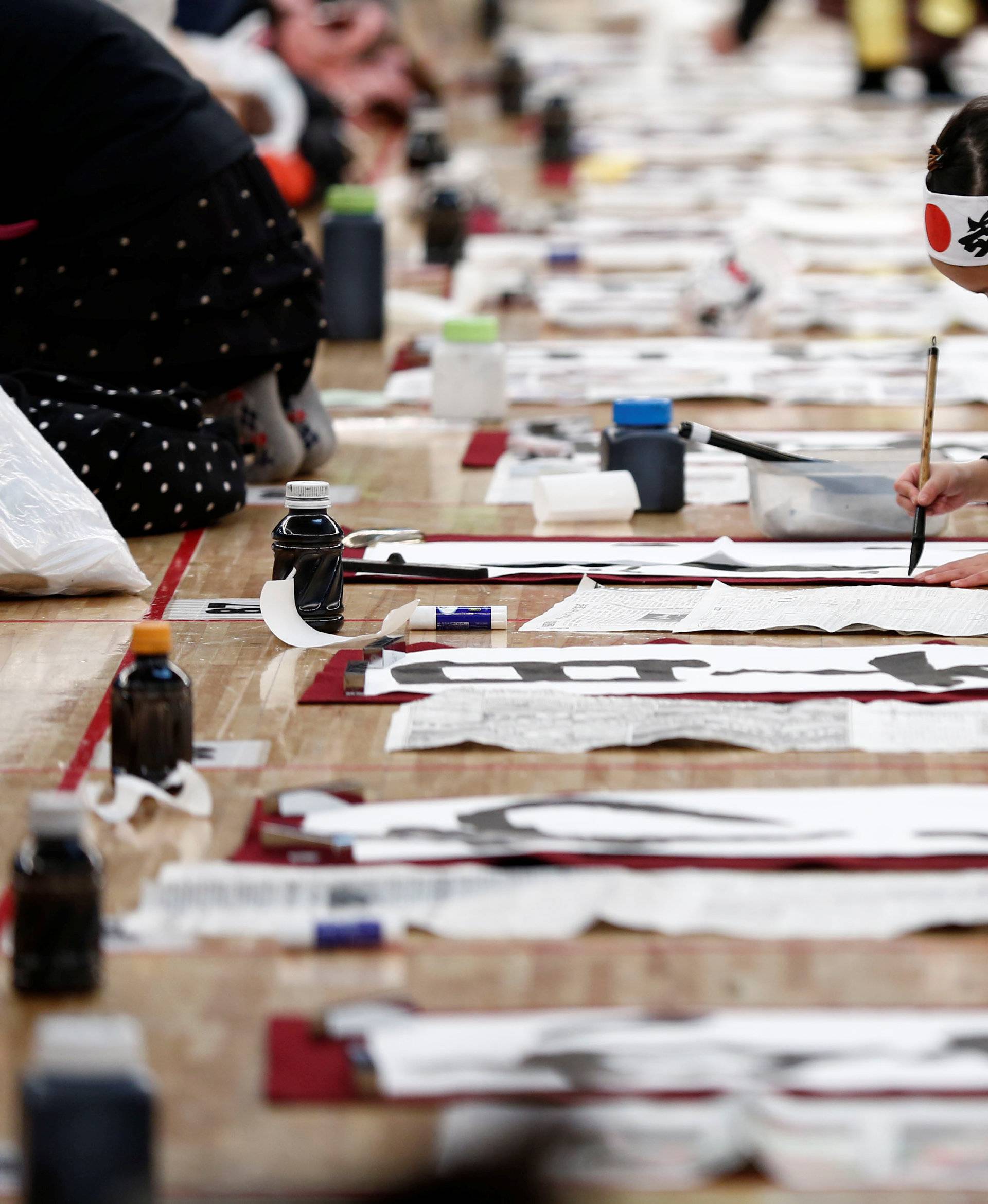 A girl participates in a New Year calligraphy contest in Tokyo