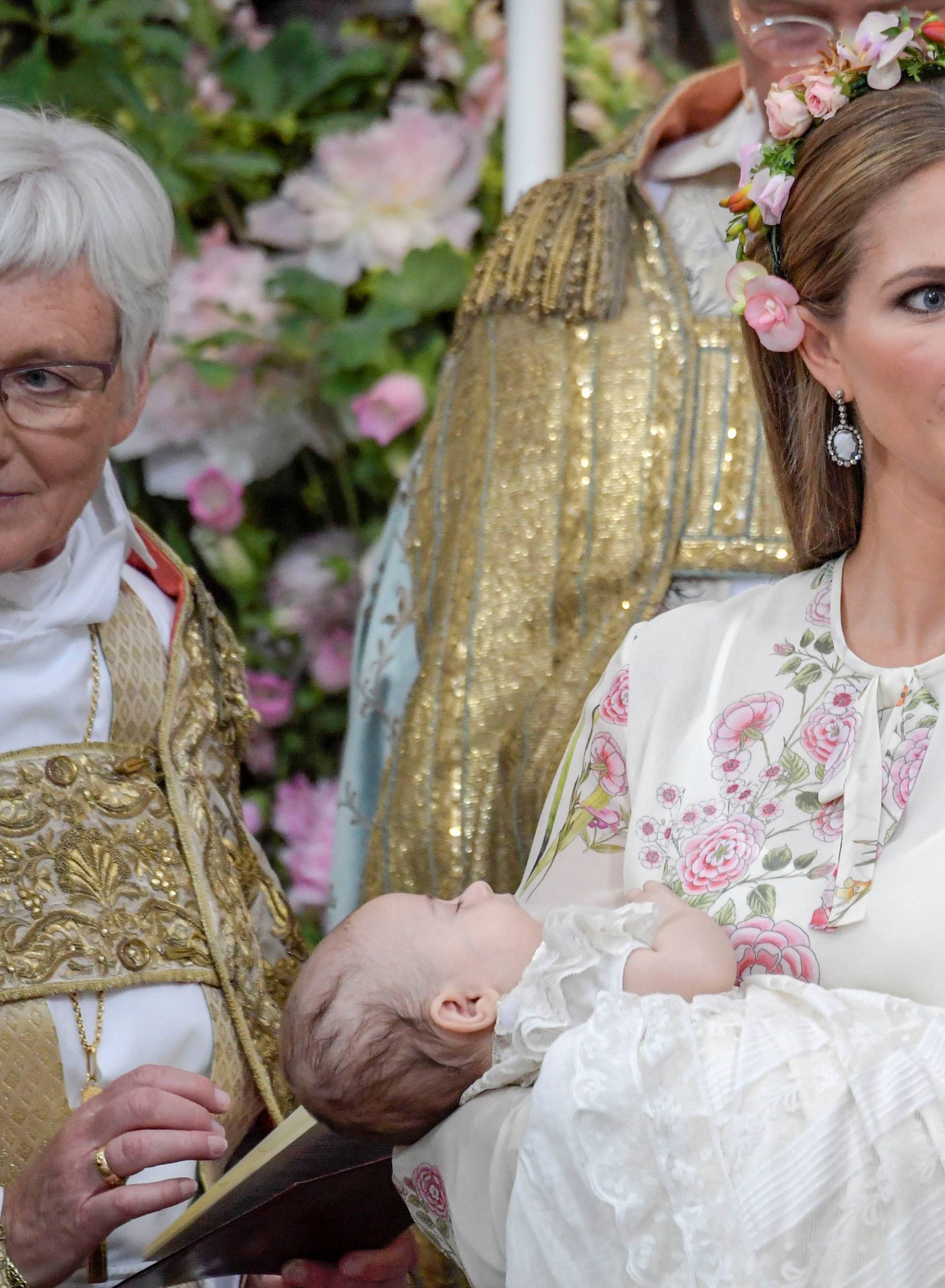 Princess Madeleine and officiant Archbishop Antje Jackelen are seen during  princess Adrienne's christening ceremony in Drottningholm Palace Chapel, Stockholm