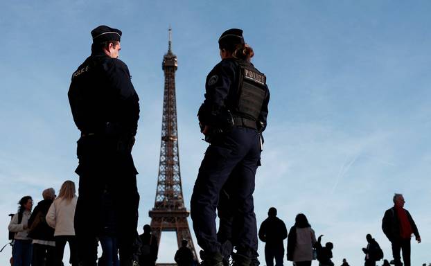 French police patrol near the Eiffel Tower in Paris