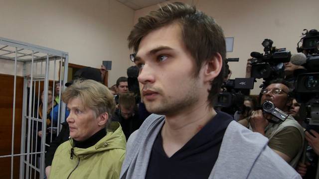 Ruslan Sokolovsky, a blogger who is accused by a state prosecutor for playing Pokemon Go inside an Orthodox church, appears with mother Yelena Chingina in a court during his sentencing in Yekaterinburg
