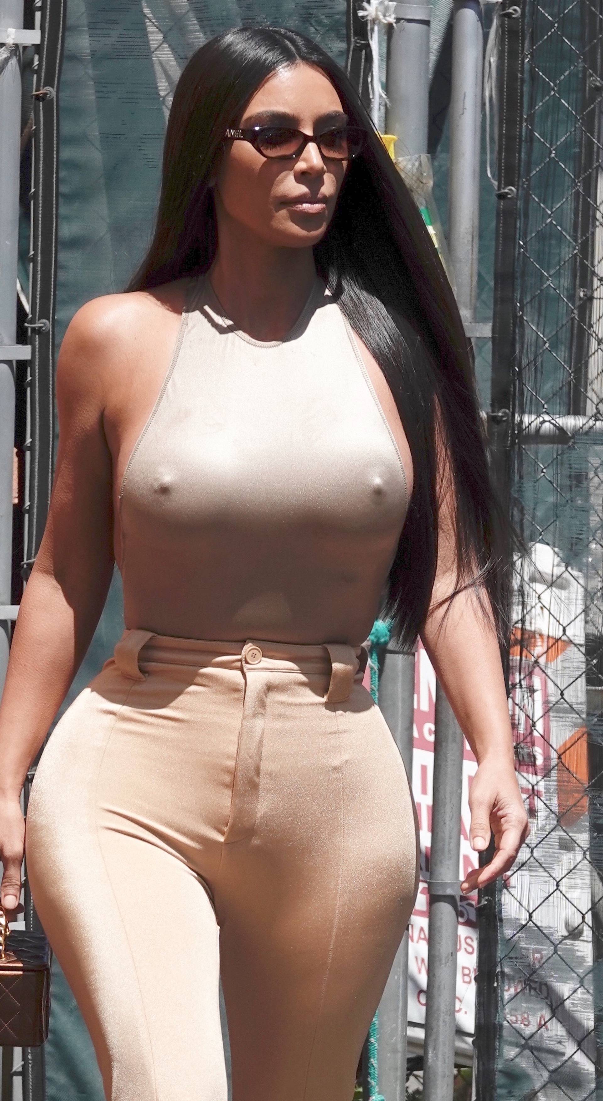 Kim Kardashian is seen leaving the back door of a restaurant in LA with her sister Khloe.