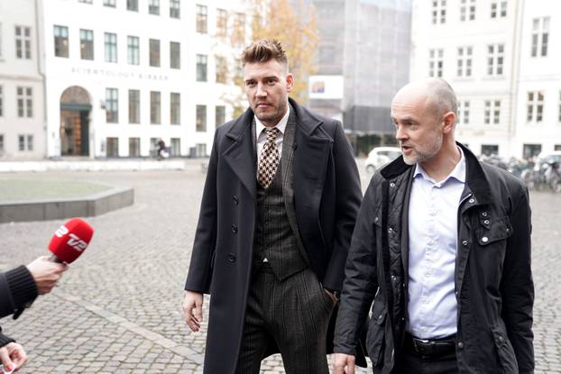 Denmark striker Nicklas Bendtner and lawyer Anders Nemeth arrive at the Copenhagen City Council