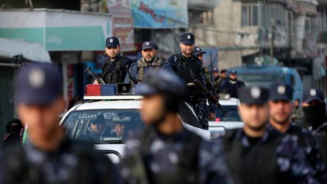 Palestinian policemen loyal to Hamas participate in a march as they protest against the U.S. Middle East peace plan, in Khan Younis in the southern Gaza Strip