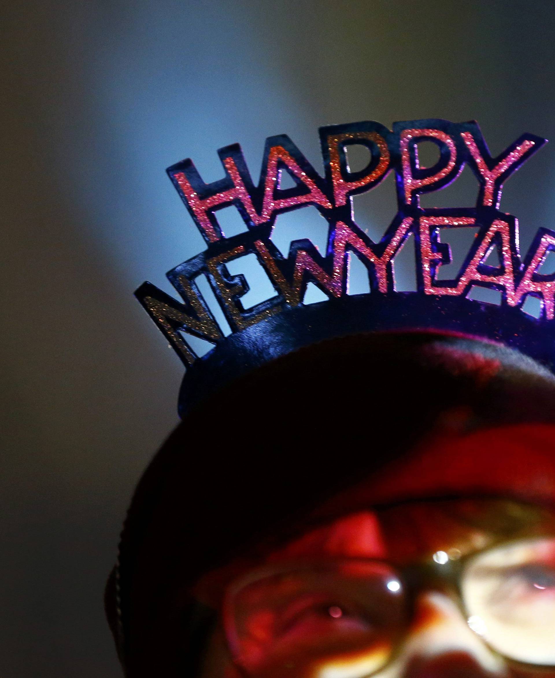 A woman waits for the New Year celebrations for 2017 in Cologne