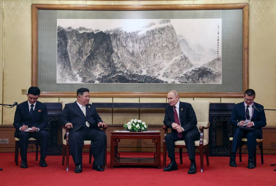 Russian President Vladimir Putin meets with North Korean leader Kim Jong Un in Beijing