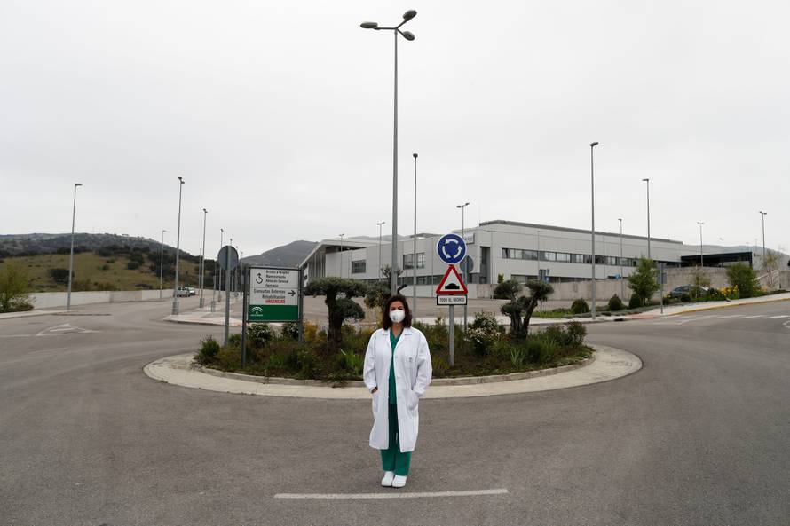 Maria Jose Garcia, an intensive care unit nurse, poses outside her workplace, a hospital, amid the coronavirus disease (COVID-19) outbreak, in Ronda