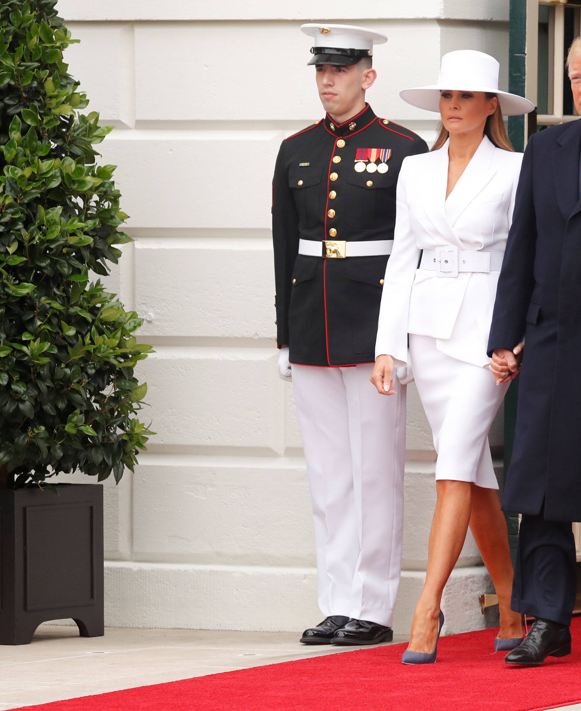 U.S. President Donald Trump and first lady Melania Trump welcome French President Emmanuel Macron and his wife Brigitte Macron during an arrival ceremony at the White House in Washington