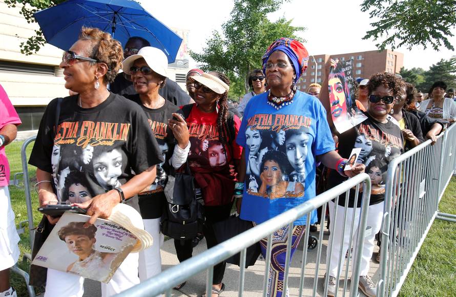 Members of the public wait in line outside the Charles H. Wright African American Museum where the late singer Aretha Franklin will lie in state for two days of public viewing in Detroit,