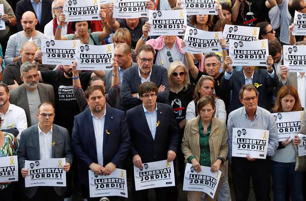 Catalan President Puigdemont and other government members attend a demonstration organised by Catalan pro-independence movements ANC (Catalan National Assembly) and Omnium Cutural, following the imprisonment of their two leaders in Barcelona